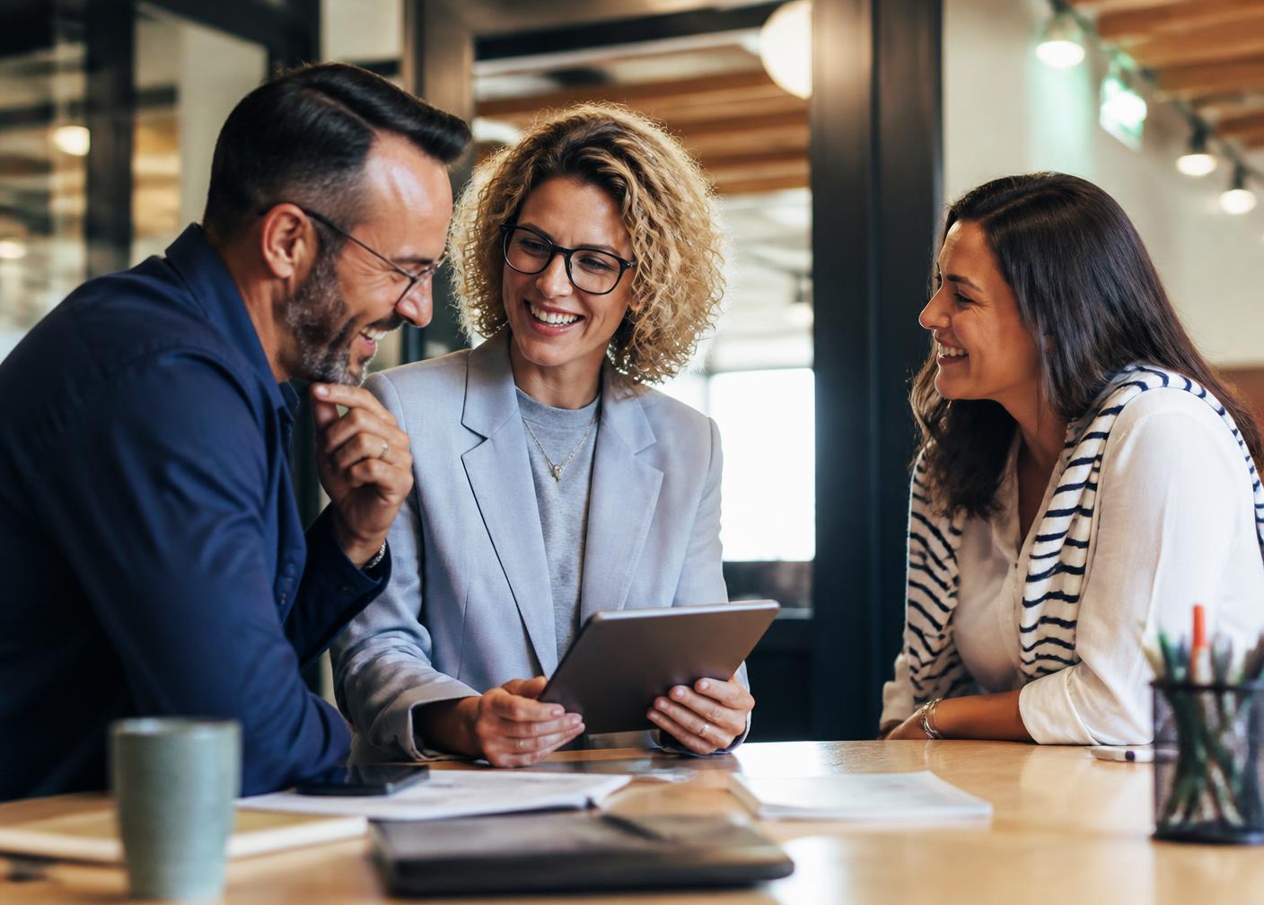 A happy small-business team covered by Phoenix MD HealthPass